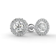a pair of diamond earrings on a white background